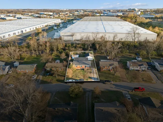 an aerial view of residential houses with outdoor space