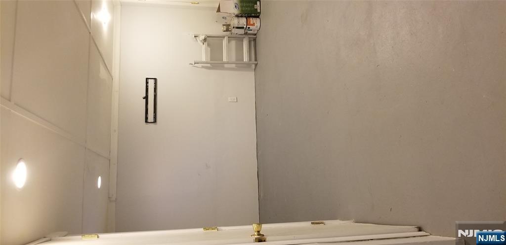 374 East Midland Avenue Paramus, NJ 07652 - Photo 11 of 12 a view of a room with racks on the wall