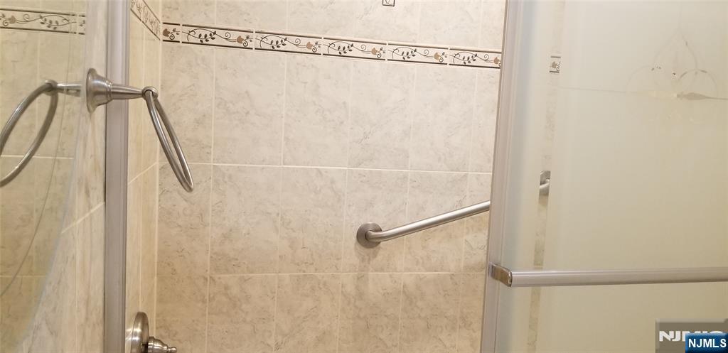 374 East Midland Avenue Paramus, NJ 07652 - Photo 3 of 12 a bathroom with a shower