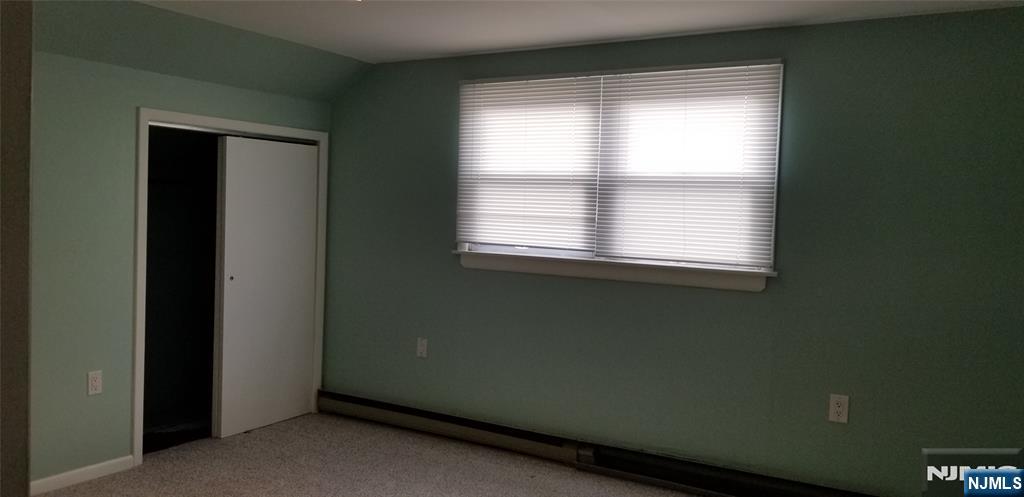 374 East Midland Avenue Paramus, NJ 07652 - Photo 8 of 12 a view of an empty room with a window
