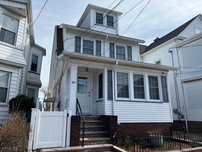 364 Chestnut Street Kearny, NJ 07032 - Photo 1 of 22 a front view of a house with balcony