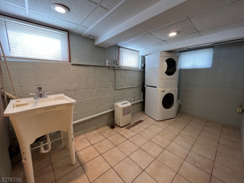 364 Chestnut Street Kearny, NJ 07032 - Photo 17 of 22 a bathroom with a sink and a toilet