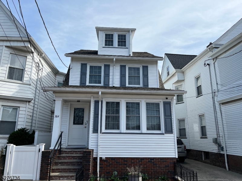 364 Chestnut Street Kearny, NJ 07032 - Photo 2 of 22 a front view of a house with a balcony