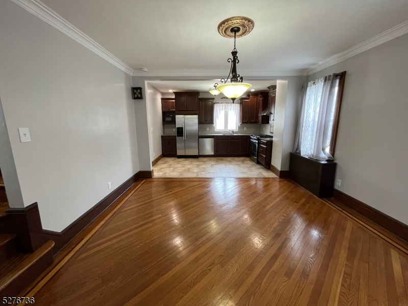 364 Chestnut Street Kearny, NJ 07032 - Photo 6 of 22 a view of kitchen and hall with wooden floor