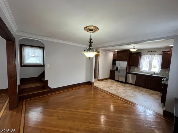 a view of an empty room and fire place