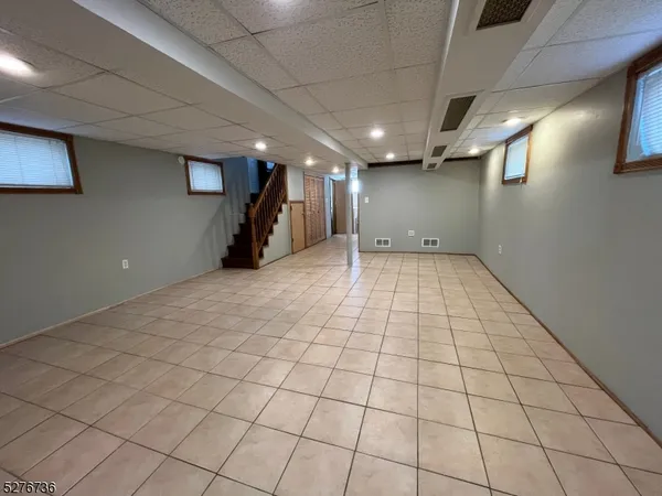 a view of an empty room and a window