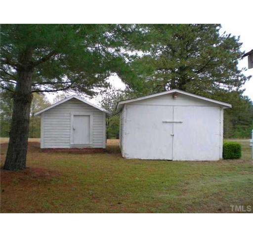 Multiple storage buildings and a two car detached garage