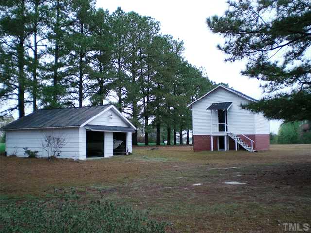 Multiple storage buildings and a two car detached garage