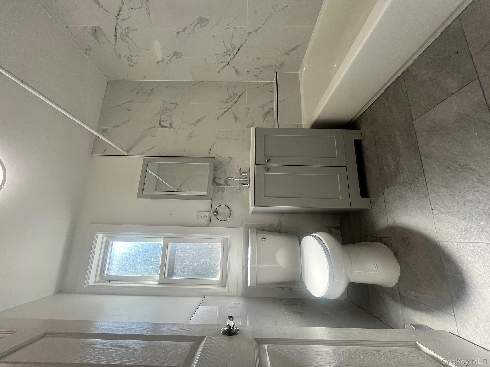 Undisclosed Address Yonkers, NY 10701 - Photo 7 of 10 a bathroom with a toilet sink and bathtub