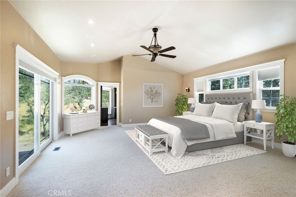 3731 Royal Mountain Road Oroville, CA 95965 - Photo 15 of 67 a spacious bedroom with a large bed and a chandelier