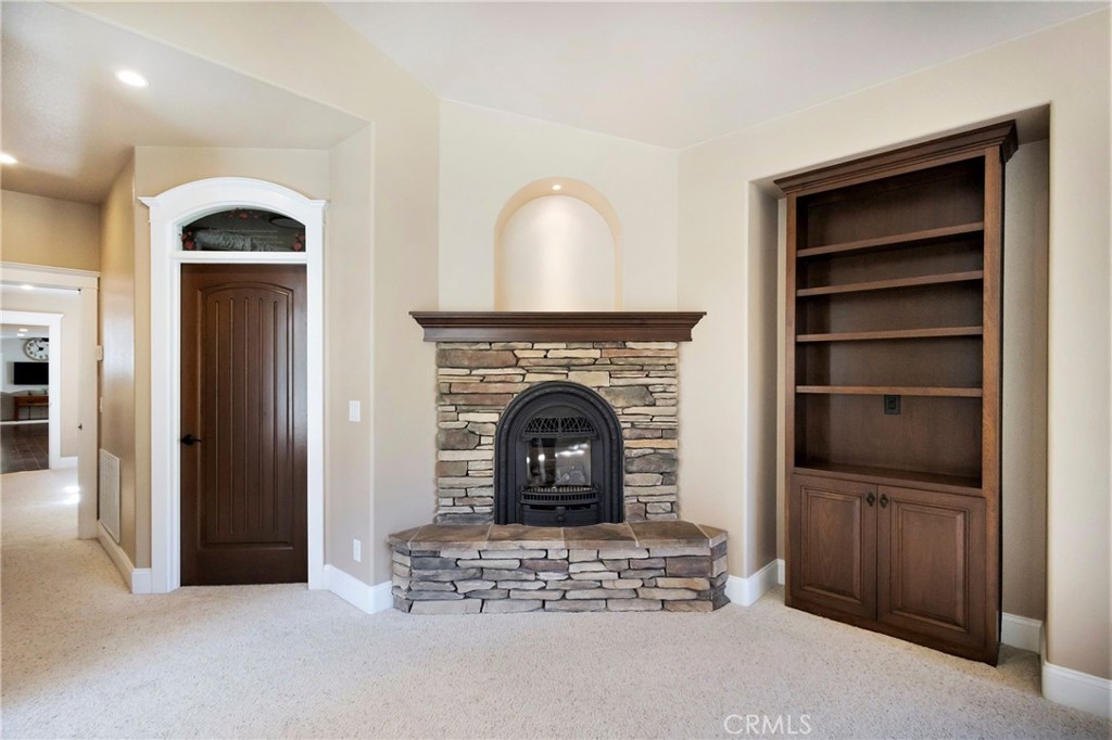 3731 Royal Mountain Road Oroville, CA 95965 - Photo 17 of 67 a living room with furniture and a fireplace