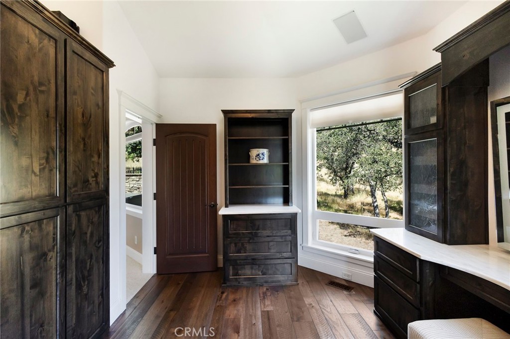 3731 Royal Mountain Road Oroville, CA 95965 - Photo 19 of 67 a kitchen with stainless steel appliances a refrigerator and wooden floor