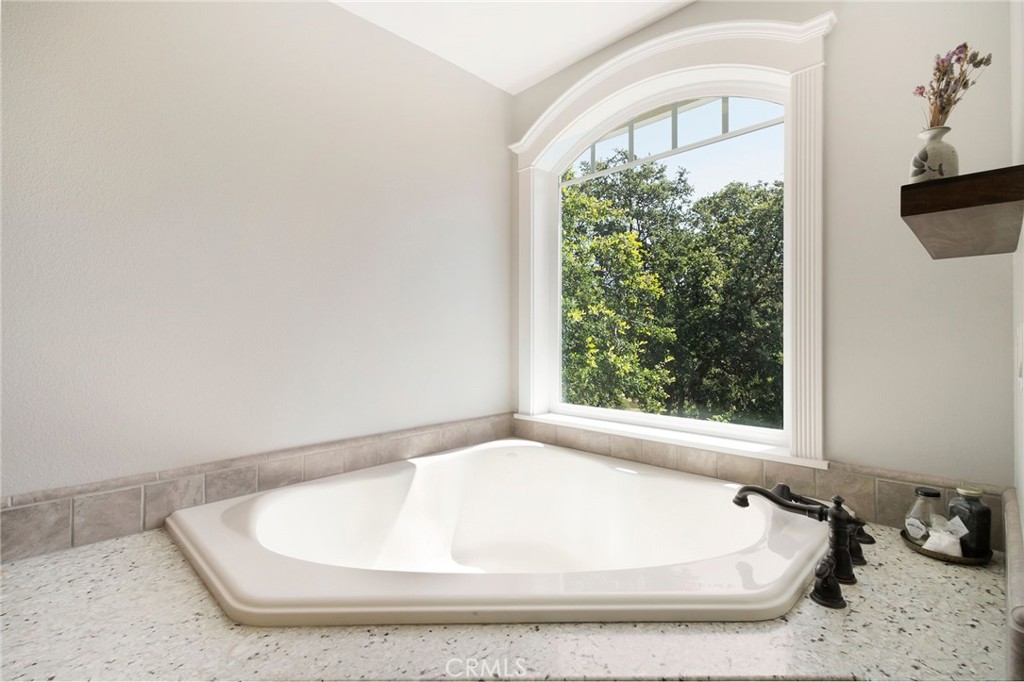3731 Royal Mountain Road Oroville, CA 95965 - Photo 22 of 67 a white bath tub sitting in a bathroom