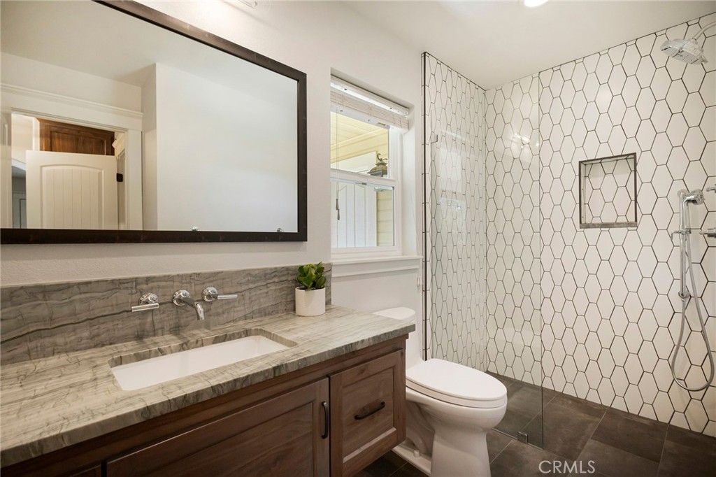 3731 Royal Mountain Road Oroville, CA 95965 - Photo 24 of 67 a bathroom with a granite countertop sink toilet and mirror