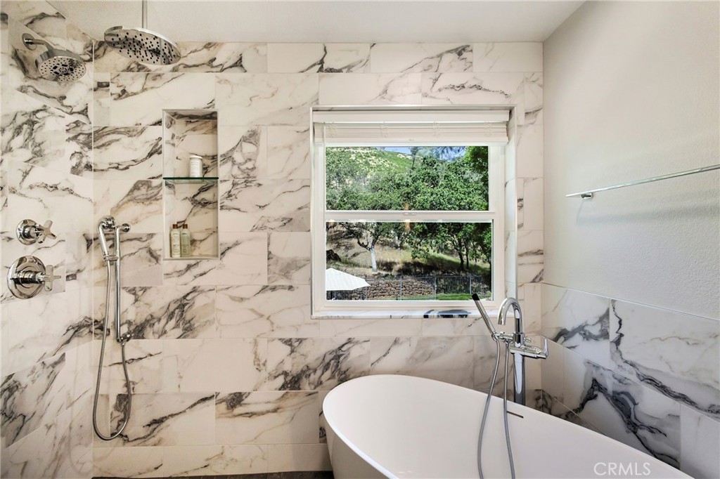 3731 Royal Mountain Road Oroville, CA 95965 - Photo 39 of 67 a bath tub sitting in a bathroom next to a window