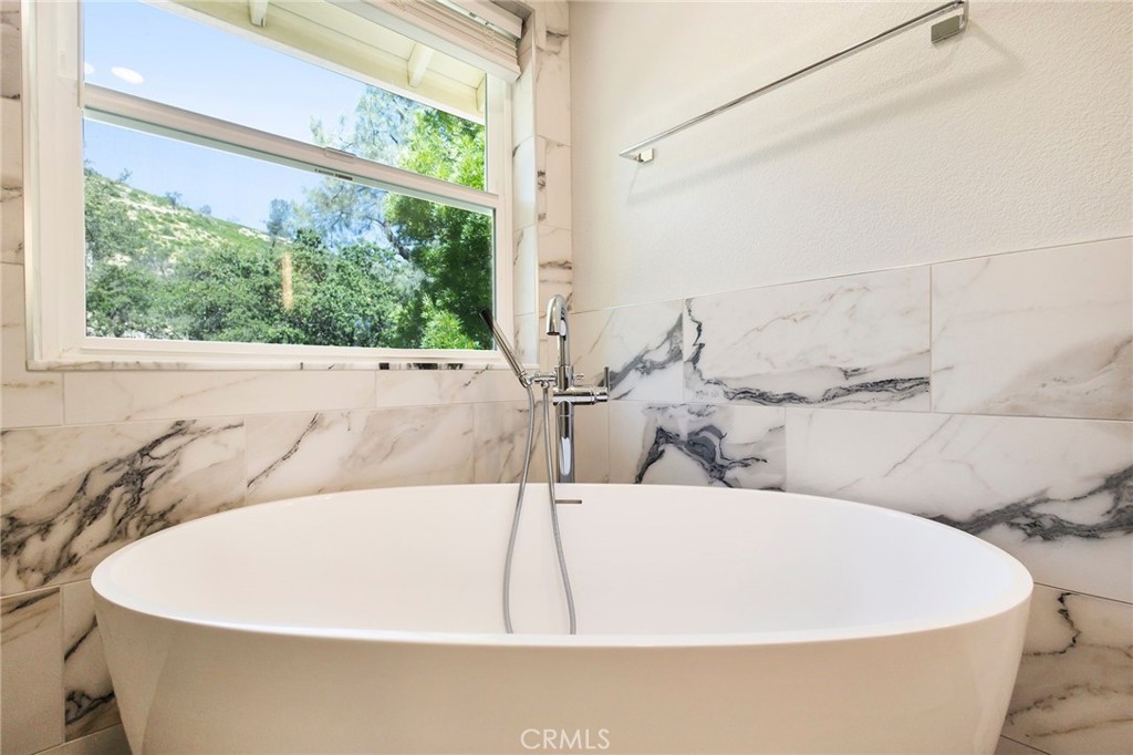 3731 Royal Mountain Road Oroville, CA 95965 - Photo 40 of 67 a white bath tub sitting in a bathroom