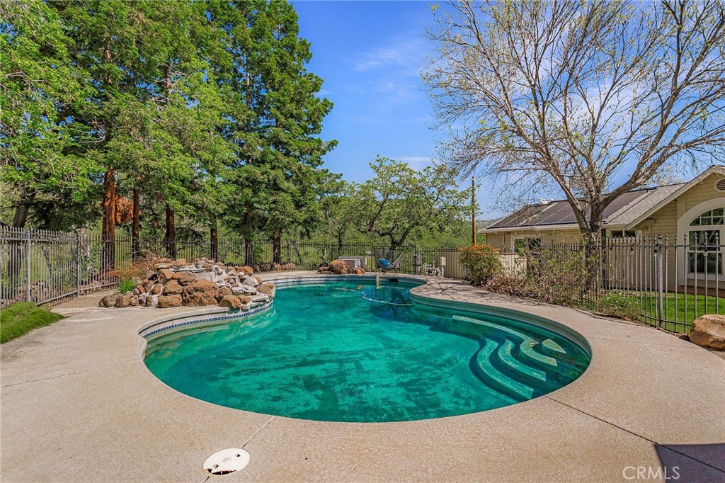 3731 Royal Mountain Road Oroville, CA 95965 - Photo 46 of 67 a view of a swimming pool with a yard