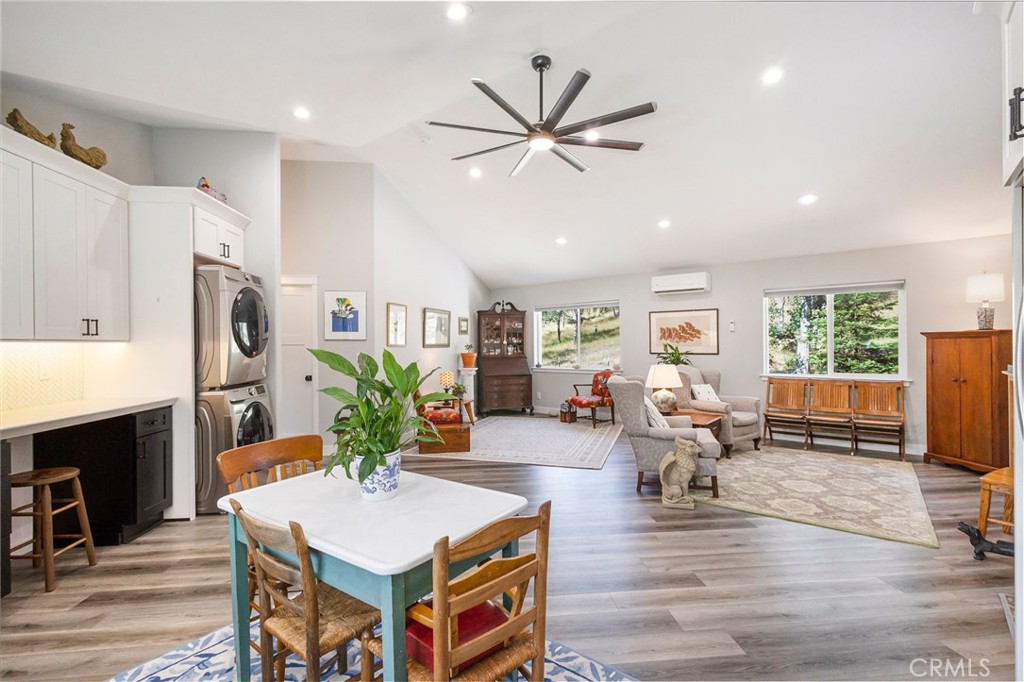 3731 Royal Mountain Road Oroville, CA 95965 - Photo 66 of 67 a living room with fireplace furniture flat screen tv and wooden floor
