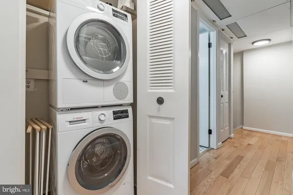 a view of a hallway with washer and dryer