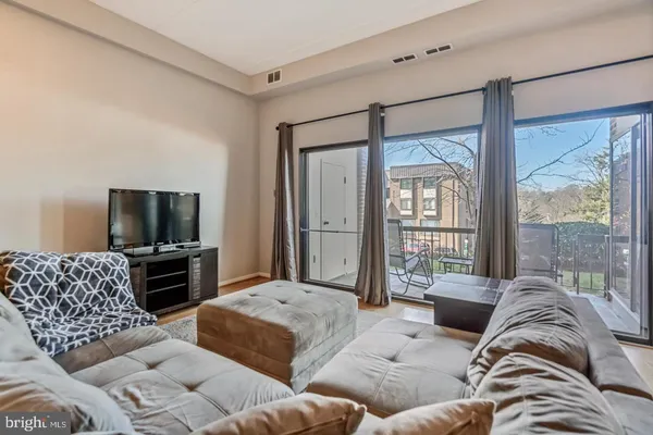 a living room with furniture or couch and a flat screen tv