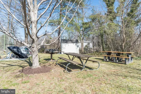 a view of a yard with table and chairs