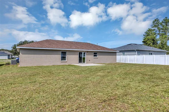 an aerial view of a pool yard residential house and outdoor space