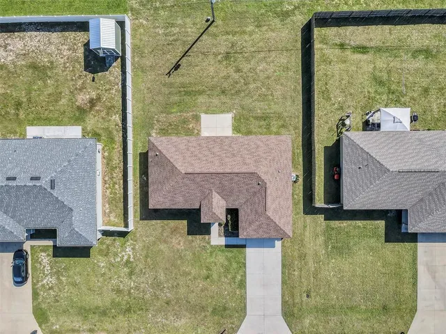 a kitchen with stainless steel appliances granite countertop a stove a refrigerator a oven a sink with a dining table and chairs