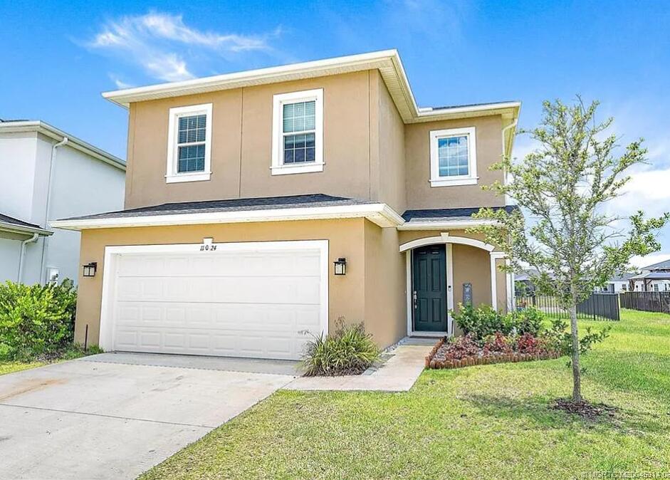 11024 Pacini Way Port St. Lucie, FL 34987 - Photo 1 of 16 a front view of a house with a yard