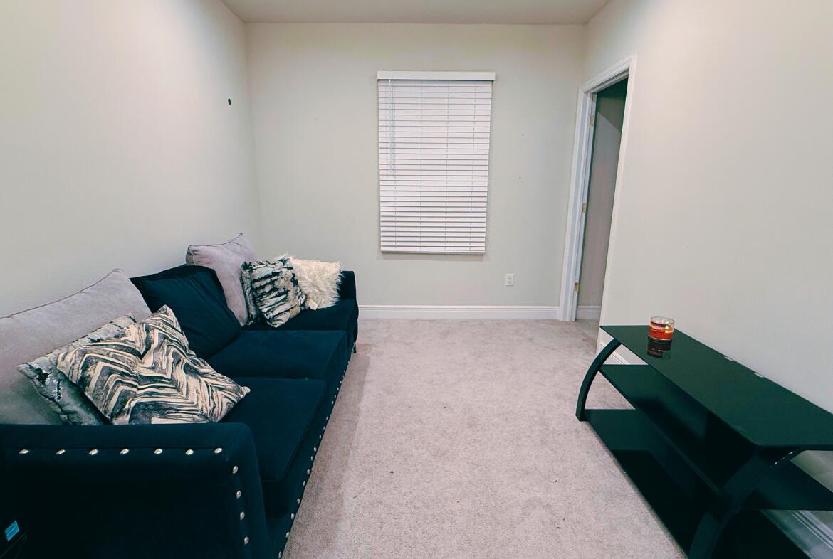 11024 Pacini Way Port St. Lucie, FL 34987 - Photo 11 of 16 a bedroom with a bed and a window