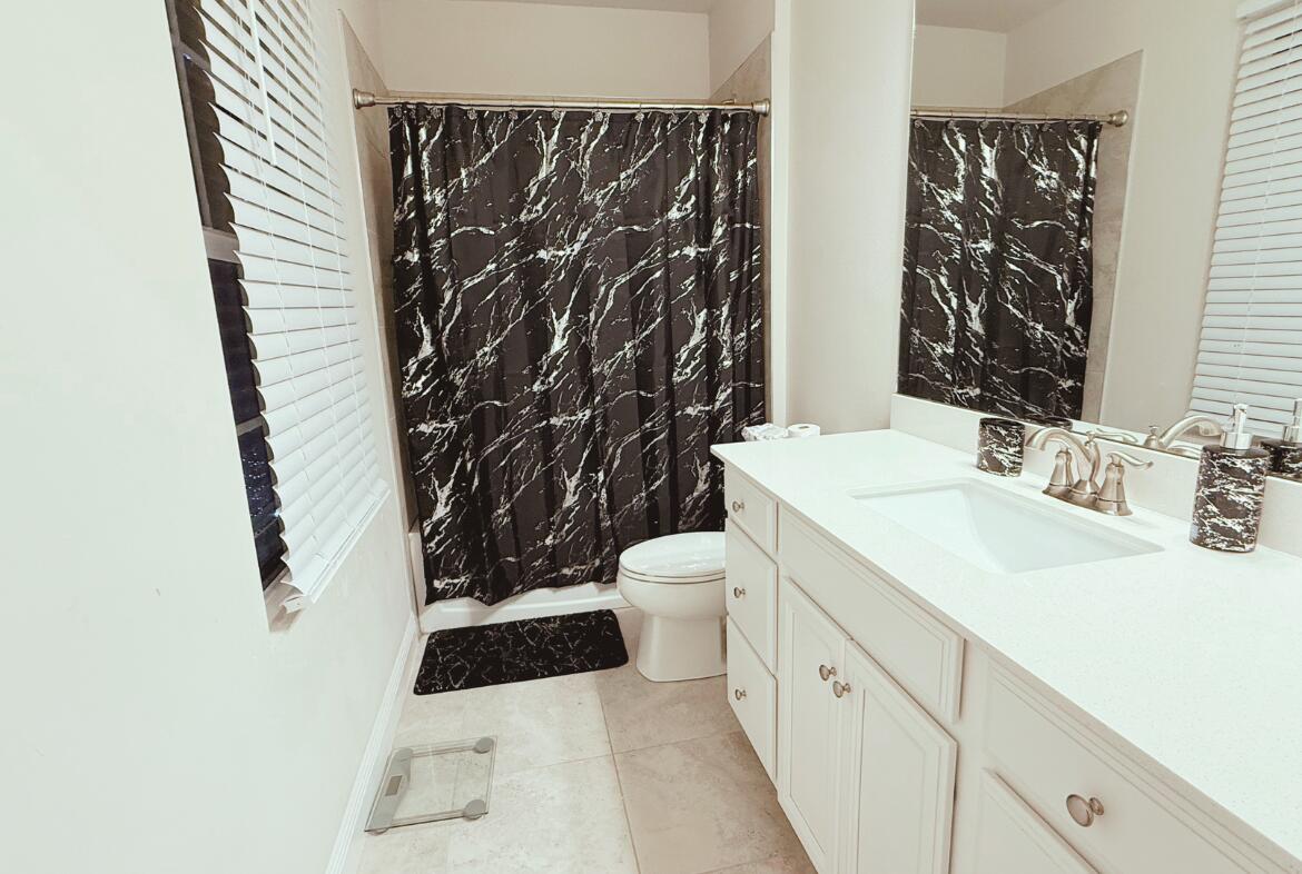 11024 Pacini Way Port St. Lucie, FL 34987 - Photo 10 of 16 a bathroom with a sink and a toilet