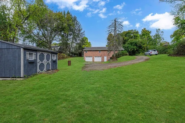 a view of a house with a big yard