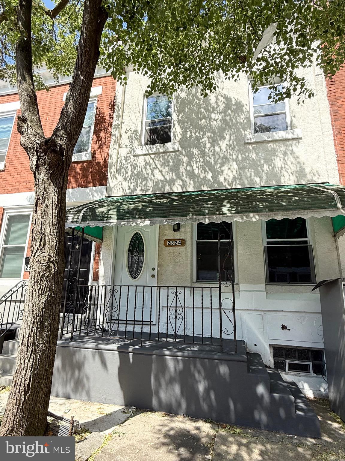 2324 North Lambert Street Philadelphia, PA 19132 - Photo 2 of 13 a front view of a house with parking