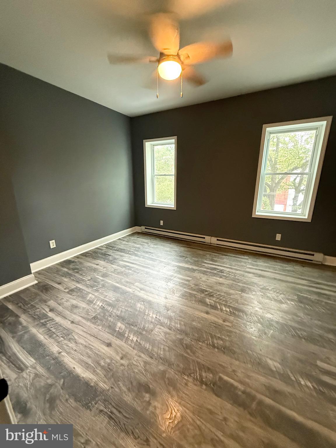 2324 North Lambert Street Philadelphia, PA 19132 - Photo 10 of 13 a view of an empty room with window and chandelier fan