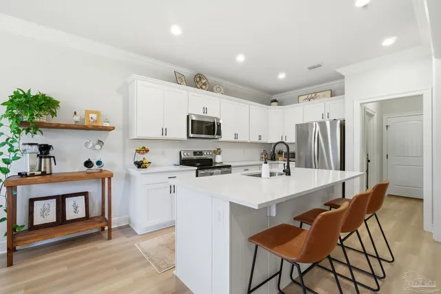 a living room with fireplace furniture and a flat screen tv