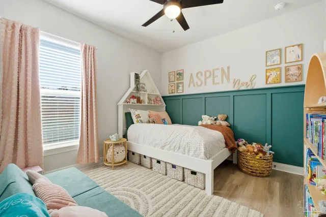 a a bathroom with a toilet and shower curtain