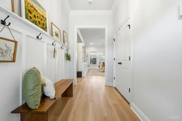 a view of an entryway with wooden floor