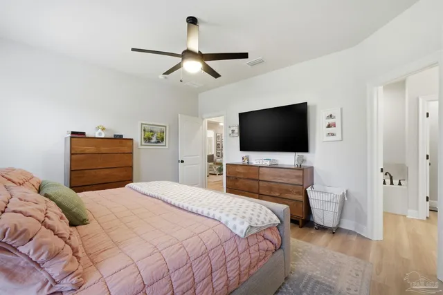 a view of a walk in closet and bathroom