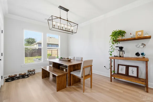 a view of a dining room with furniture window and outside view