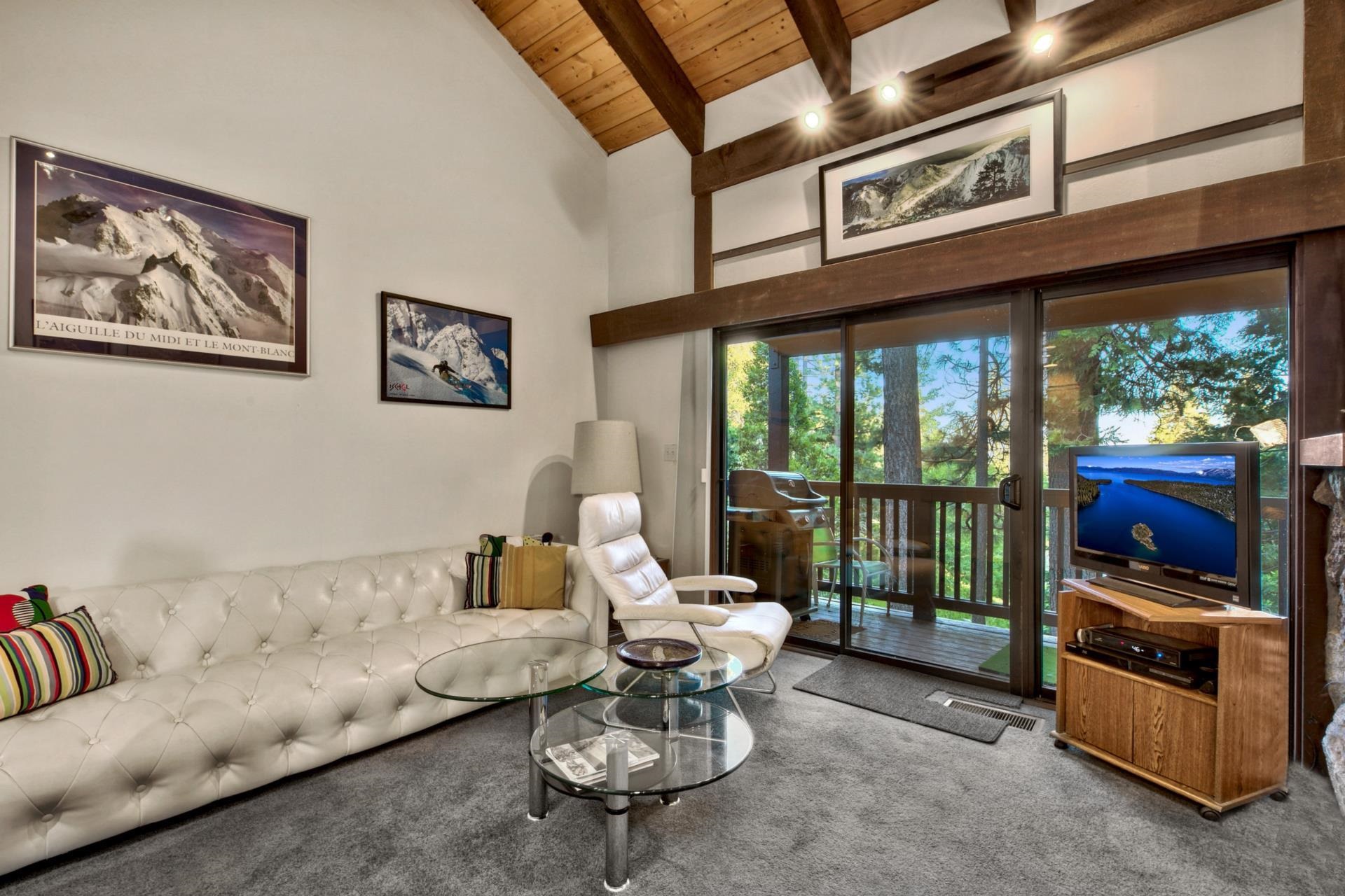 2755 North Lake Boulevard, Unit 9 Tahoe City, CA 96145 - Photo 11 of 21 a living room with furniture and a flat screen tv