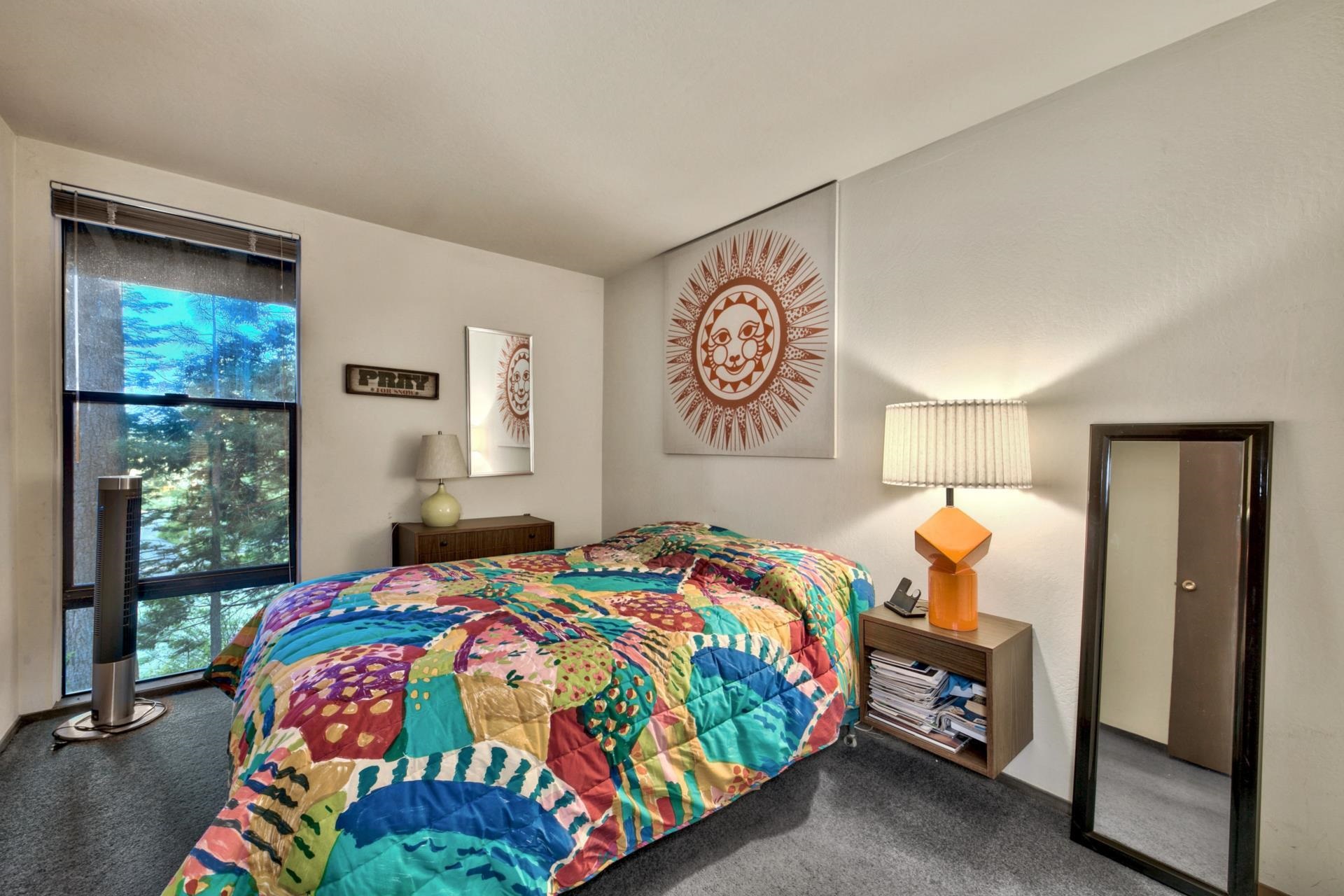 2755 North Lake Boulevard, Unit 9 Tahoe City, CA 96145 - Photo 16 of 21 a bedroom with a bed and a window