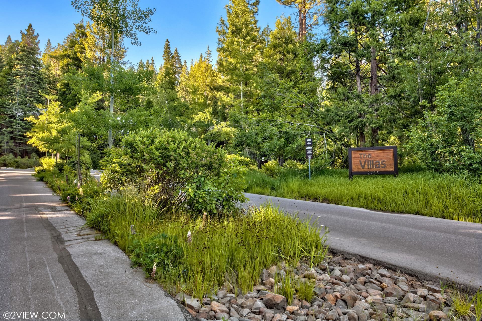 2755 North Lake Boulevard, Unit 9 Tahoe City, CA 96145 - Photo 21 of 21 a view of a garden with plants and large trees