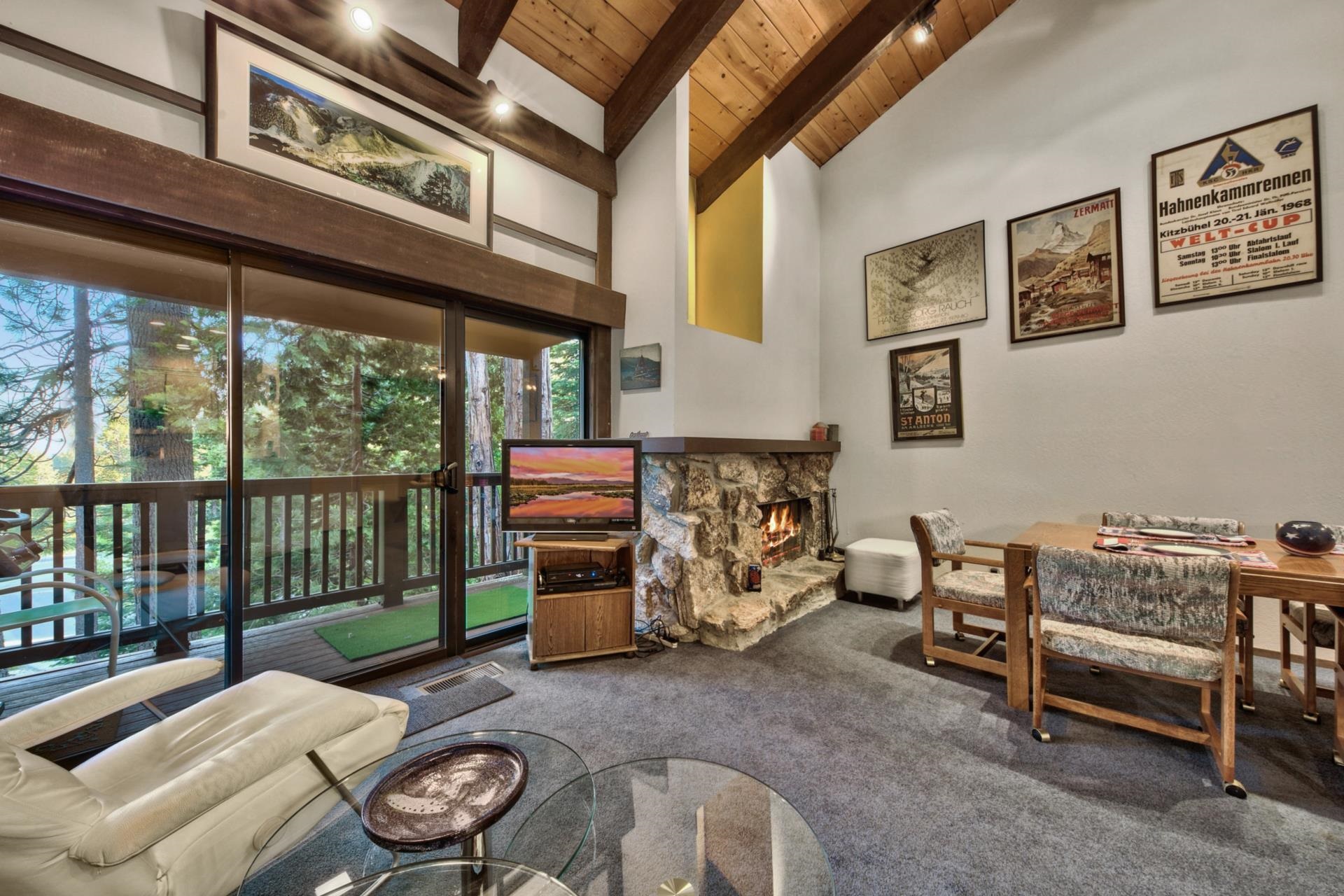 2755 North Lake Boulevard, Unit 9 Tahoe City, CA 96145 - Photo 7 of 21 a living room with furniture and a floor to ceiling window