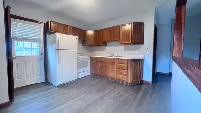 a bathroom with a sink toilet vanity and shower