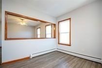 315 Woronoco Road Russell, MA 01071 - Photo 17 of 42 an empty room with wooden floor and windows