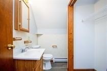 315 Woronoco Road Russell, MA 01071 - Photo 35 of 42 a bathroom with a sink toilet and mirror