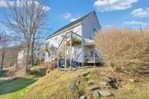 315 Woronoco Road Russell, MA 01071 - Photo 6 of 42 a backyard of a house with table and chairs