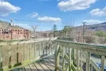 a kitchen with a refrigerator sink and cabinets