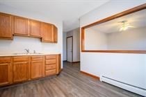 315 Woronoco Road Russell, MA 01071 - Photo 9 of 42 a kitchen with granite countertop white cabinets and white appliances
