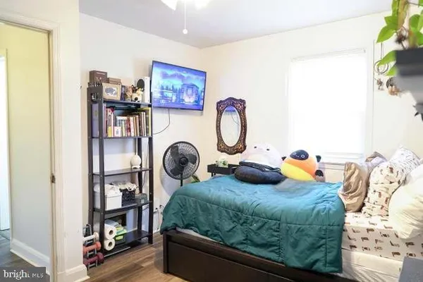 a living room with furniture a rug and a window
