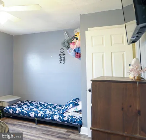 a bathroom with a toilet and a shower curtain